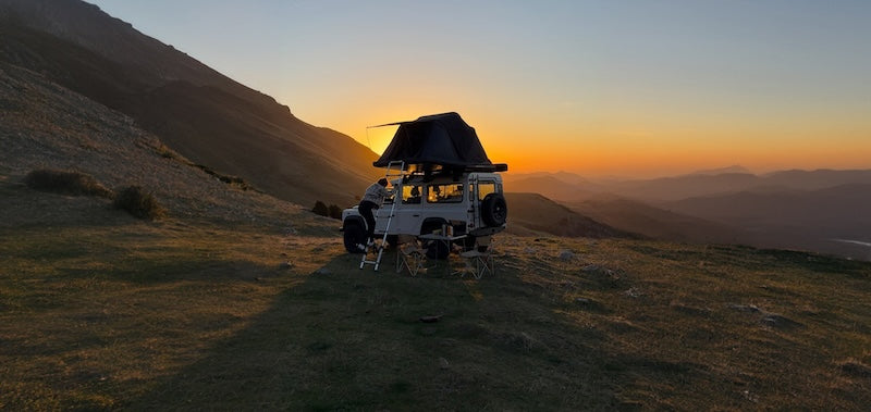 Roof Space 2 RTT on Landrover Defender with sunset in background.